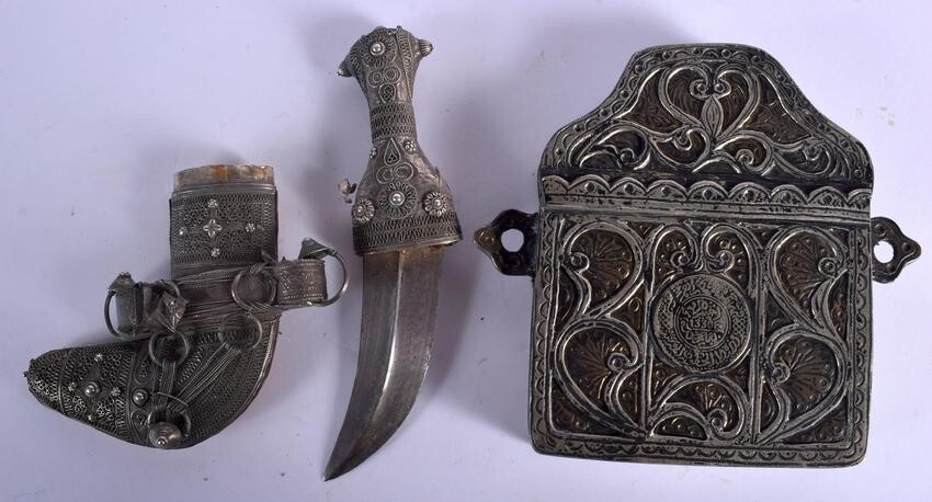 A RARE OMANI SILVER CHILDS JAMBIYA DAGGER together with