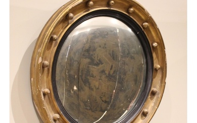 A Regency style giltwood and gesso convex wall mirror, late ...