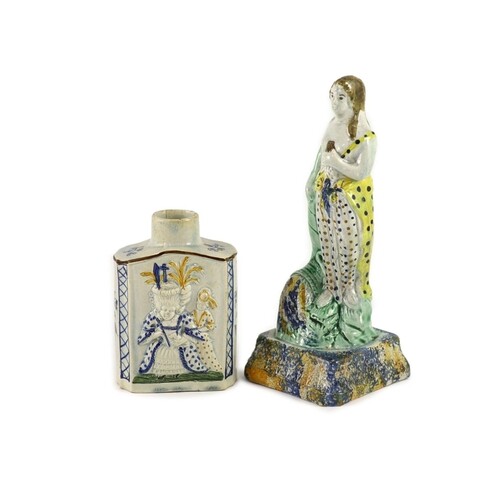 A Staffordshire Prattware pearlware tea caddy and figure of ...