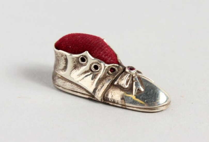 A VICTORIAN STYLE SILVER OLD BOOT PIN CUSHION.