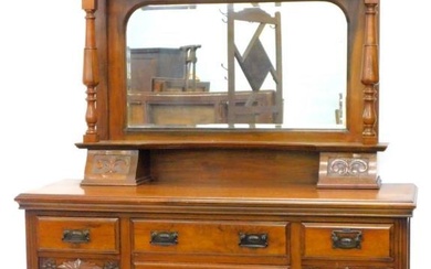 A Victorian walnut sideboard, the raised back with an...