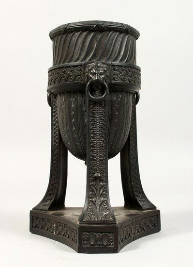 A WEDGWOOD BLACK BASALT URN, with lion ring handles, on