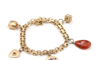 A charm bracelet of 18k gold with four charms of 14k and...