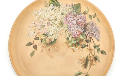A circular terracotta dish, decorated in colours with lilacs and honeysuckle. P....