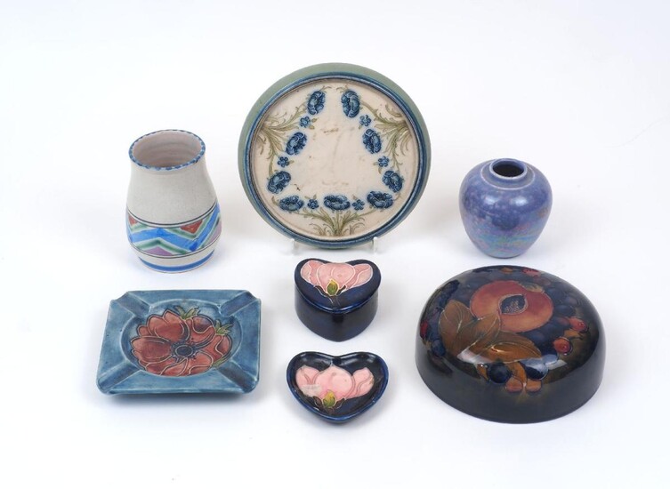 A group of modern decorative pottery, comprising a Moorcroft ash tray, 12cm x 12cm, a Moorcroft heart shaped pin box, a Moorcroft ginger jar cover a McIntyre pin dish with flower motif, a small Ruskin lustre vase & small Poole vase (6)