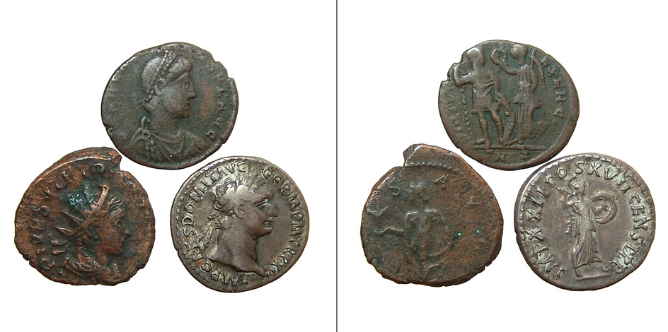A group of three Roman bronze and silver coins