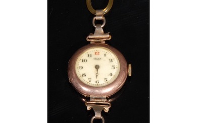 A lady's Rolex 9ct rose gold watch, white enamel dial, Arabi...