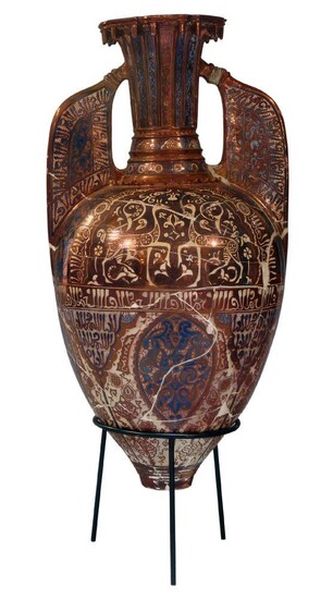 A large continental pottery copper lustre decorated "Alhambra" vase, late 19th century, possibly Theodore Deck or Samson, modelled after the 'Alhambra Gazelle Vase', of tapered form, flanked by typical flat handles, decorated overall with scrolling...