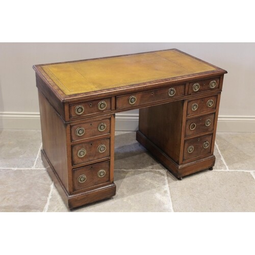 A late 19th century mahogany twin pedestal desk, the rectang...