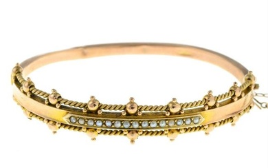 A late Victorian 9ct gold split pearl bangle.