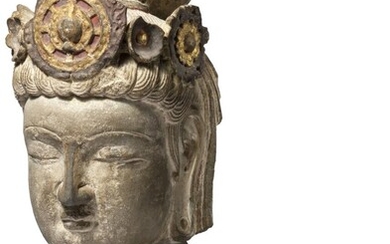 SOLD. A limestone head of a bodhisattva. Possibly Sui Dynasty 581-618. H. 33 cm. – Bruun Rasmussen Auctioneers of Fine Art