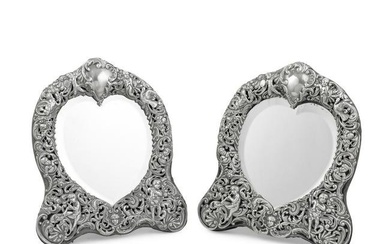 A matched pair of ornate silver-mounted mirrors William Comyns, London 1895 and 1902 (2)