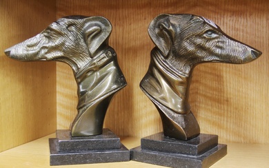 A pair of Art Deco style bronze dog head bookends, H. 21cm.