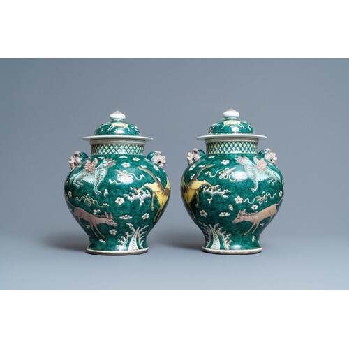 A pair of Chinese famille verte 'mythical animals' vases and...