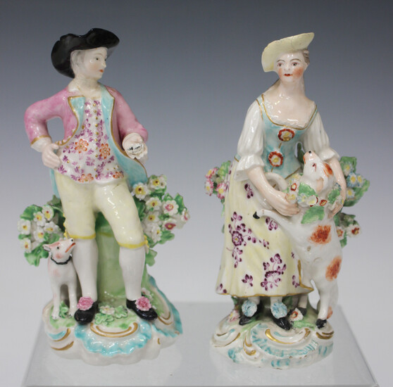 A pair of Derby porcelain figures, late 18th century, modelled as a girl with a lamb and a boy holdi