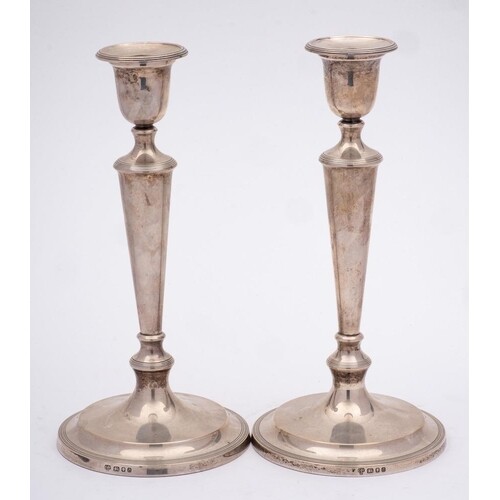 A pair of Elizabeth II silver candlesticks, maker C J Vander...