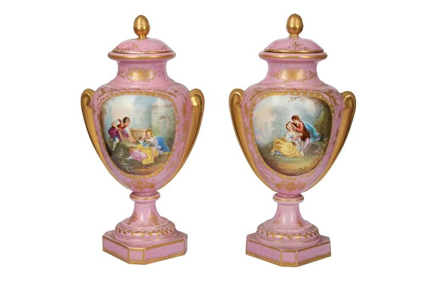 A pair of French late 19th/early 20th century Sevres style porcelain vases and covers