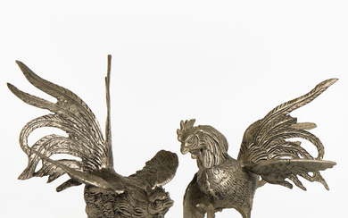 A pair of white metal roosters table decorations, 20th century.