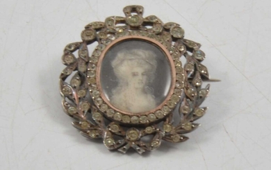 A paste set brooch with portrait miniature of a Georgian lady to centre, testing as silver.