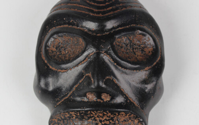 A pre-Columbian Taino style carved black stone zemi mask, Dominican Republic, probably 1000-1500 AD