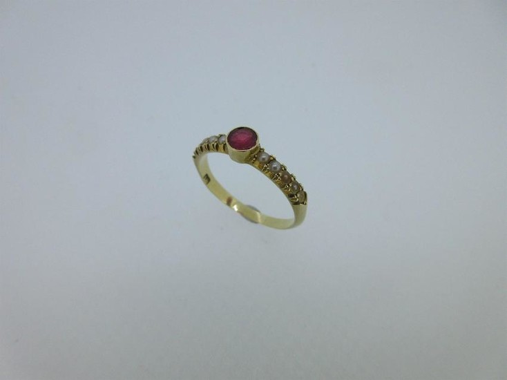 A ruby and seed pearl ring