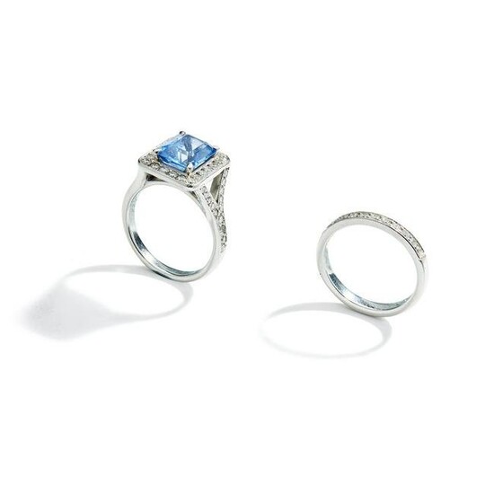 A sapphire and diamond ring and diamond half-hoop ring