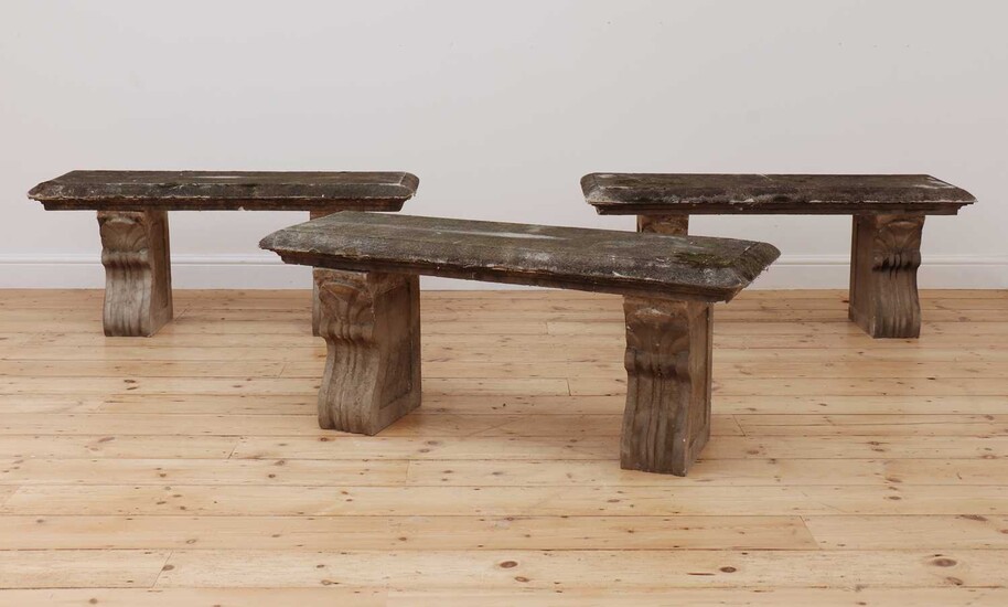 A set of three composite stone benches