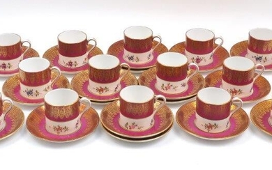 A set of twelve Hammersley coffee cans and saucers, 20t century, of cream and red ground with gilt border to the rims, together with an extra four saucers (lot)