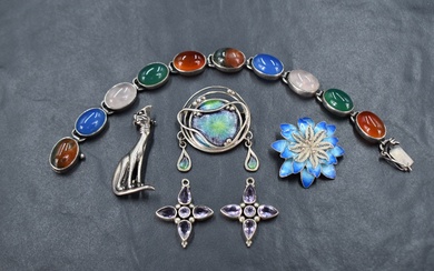 A small selection of silver jewellery including two enamelled brooches, cat brooch amethyst style