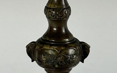 AN ANTIQUE JAPANESE BRASS CANDLE HOLDER, 19TH CENTURY