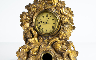American gilt cast iron and wood figural mantel clock