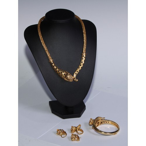 An 18ct gold leopard parure, each element set with sapphires...