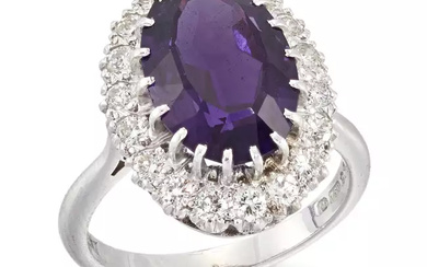 An 18ct white gold amethyst and diamond cluster ring, an...
