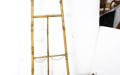 An Aesthetic Movement bamboo canterbury and easel, late 19th/early 20th century, the first lacquer