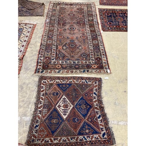 An antique Caucasian red ground rug, 250 x 125 cm and a sma...
