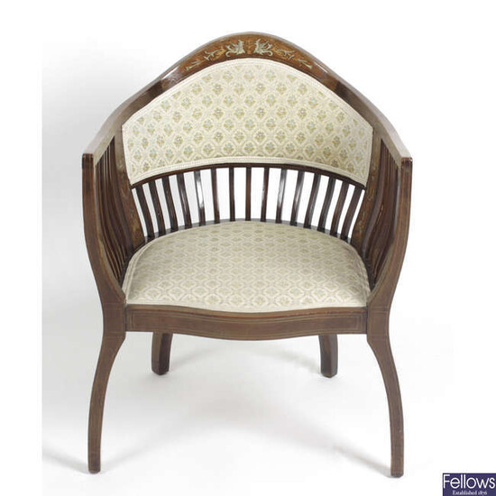 An early 20th century ivory and satinwood inlaid framed chair.