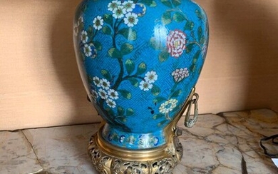 Cloisonné enamel vase with a blue background decorated with flowering branches and butterflies. Gilt bronze frame, Chinese work around 1900, Mounted as a lamp. (dent) H : 38 cm