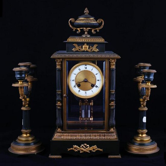 Empire mantel clock with paired candlesticks. Late XIX