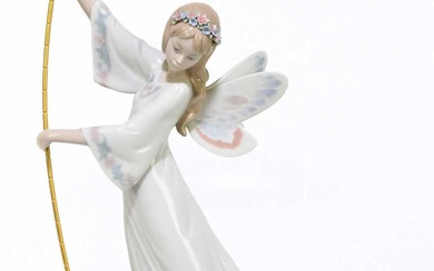 LLADRO; a ceramic figure of an angel on a gondola,...