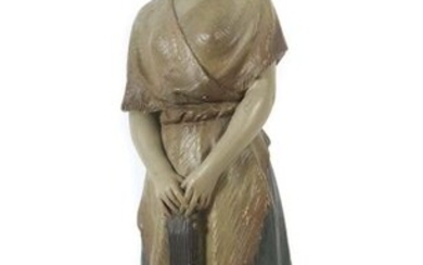 Mädchen mit Gitarre Um 1910/1920, light reddish shards, polychrome painted, a standing girl, her hands resting on the guitar head, on a rectangular plinth, looking to the left, on base no. 889, and press mark, h: approx. 60 cm. signs of age, part...