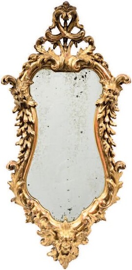 Mirror with an animated shape in carved and...