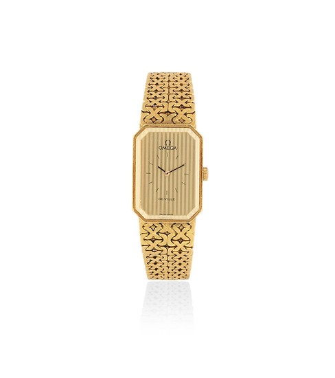 Omega. A lady's 18K gold manual wind bracelet watch