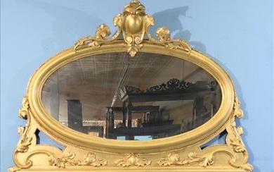 Oval gold gilded over the mantle mirror with carving, 38.5 x 57