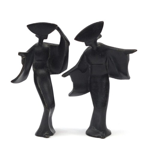 Pair of Japanese Modernist iron figures, the largest 18cm hi...