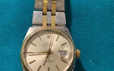 ROLEX. OYSTERQUARTZ DIGEST. Watchband in 750°/°° gold and stainless steel,...