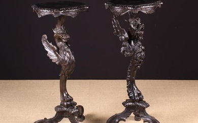 Two Similar Late 19th/Early 20th Century Carved & Ebonised Figural Torchères. The serpentine edged t