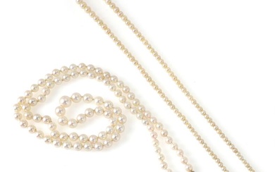 Two graduated pearl necklaces each set with numerous cultured pearls and clasps...