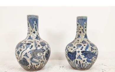 BOTTLE VASES, a pair, Chinese style blue and white ceramic, ...