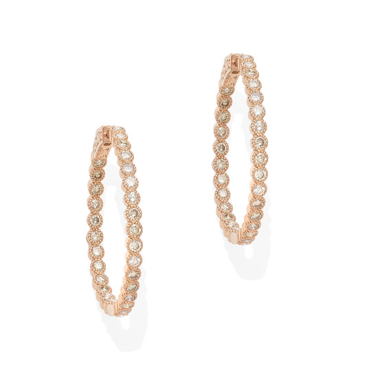 a pair of rose gold and diamond hoop earrings
