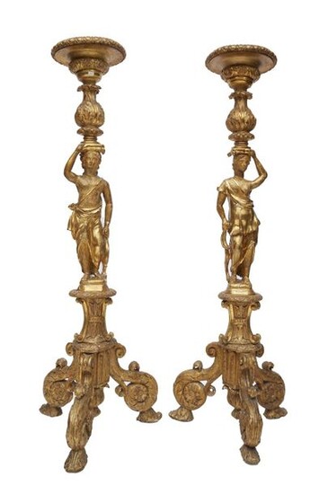 197-Pair of torchieres in carved stuccoed and gilded wood decorated...